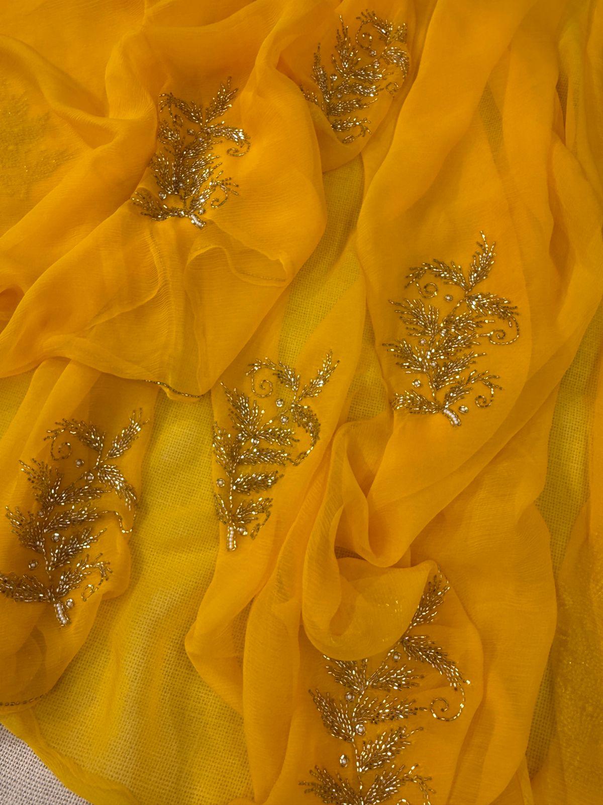 Yellow chiffon saree with debka, sequence and Resham embroidery with crepe blouse