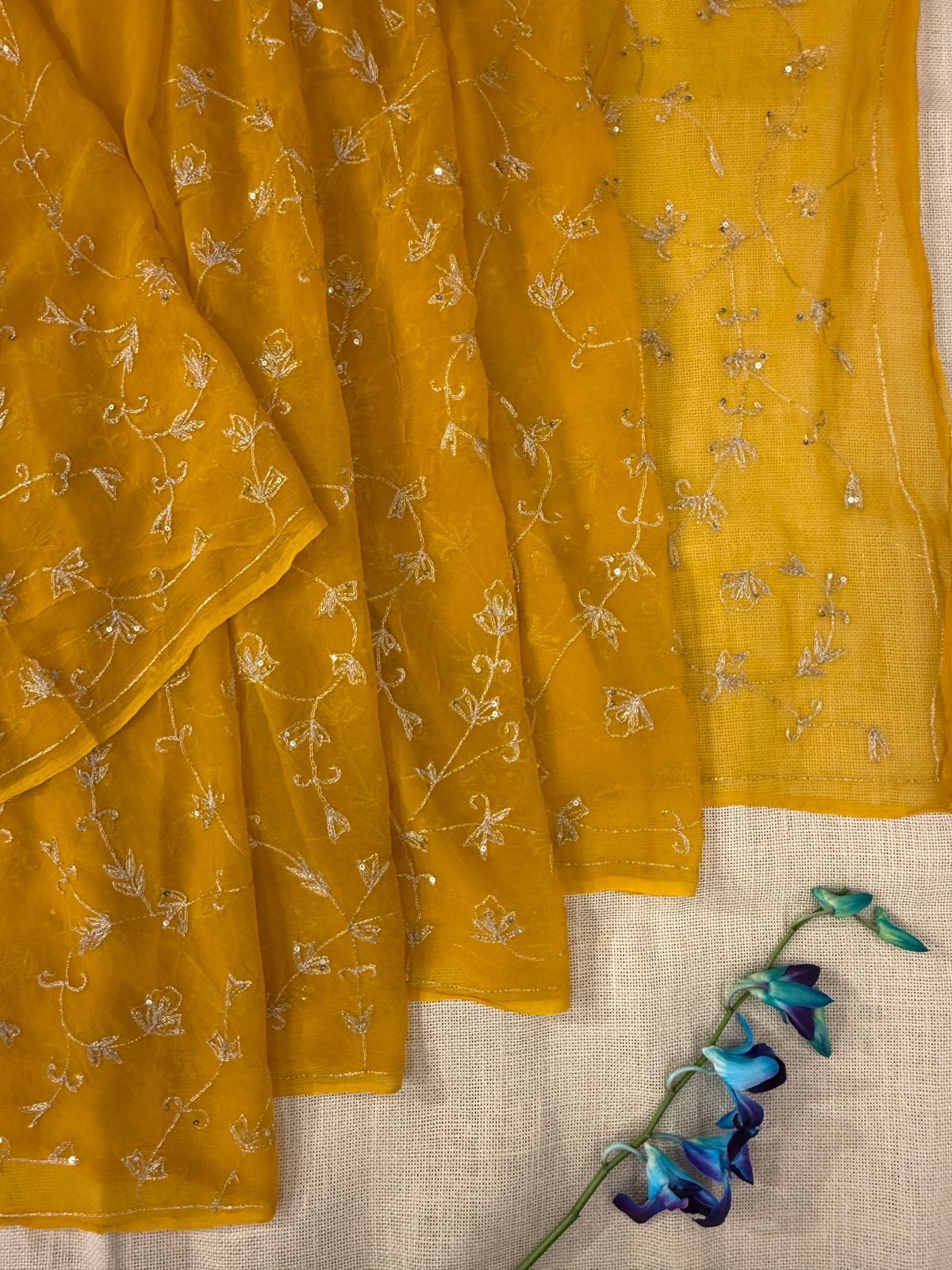 Mustard color chiffon saree with Karan and sequence embroidery